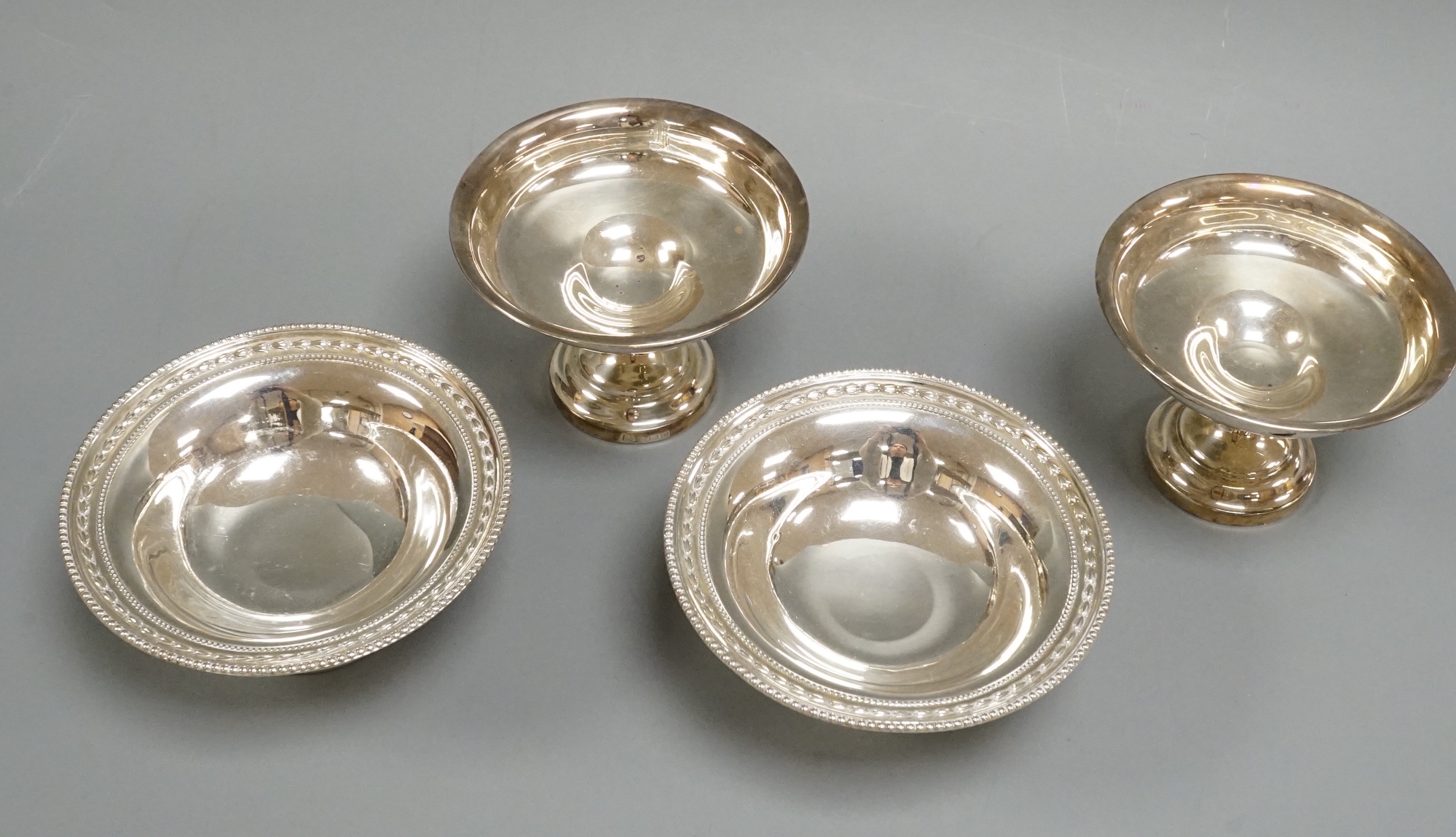 Two pairs of silver pedestal bonbon dishes, including James Dixon & Sons, Sheffield, 1898, diameter 11.4cm.